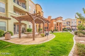 14575 W Mountain View Blvd Unit 711, Surprise, AZ 85374 - surrounding community with a pergola and a yard
