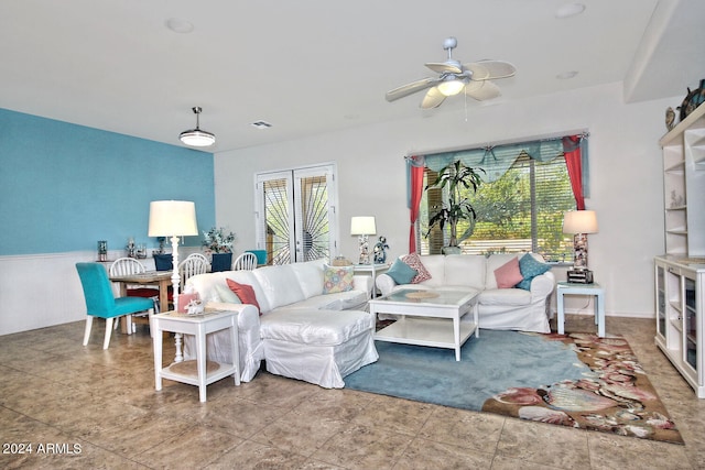 living room featuring ceiling fan and plenty of natural light