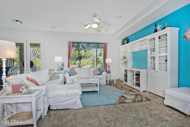 living room featuring ceiling fan and a healthy amount of sunlight