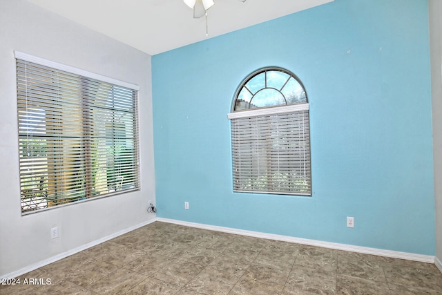 unfurnished room with ceiling fan