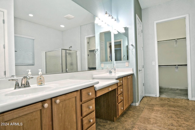 bathroom with vanity and an enclosed shower