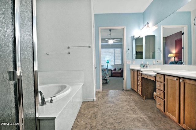 bathroom featuring a bath, vanity, and ceiling fan