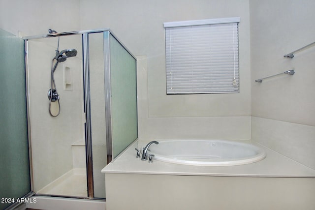 bathroom featuring plus walk in shower