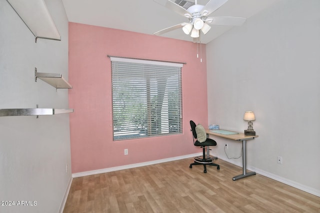 home office with ceiling fan and light hardwood / wood-style floors