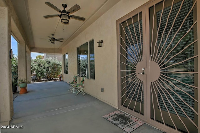 view of patio featuring ceiling fan and french doors