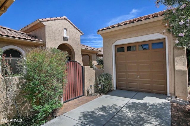 mediterranean / spanish-style home featuring a garage