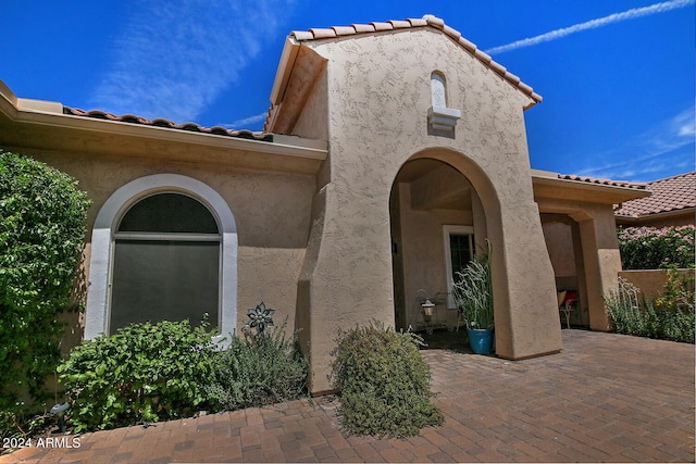 property entrance with a patio