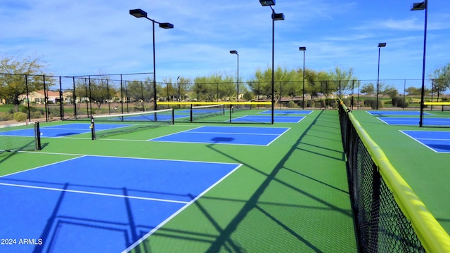 view of tennis court featuring basketball court