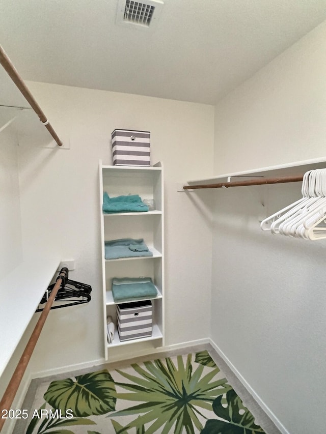 walk in closet with visible vents