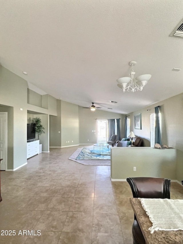 living room with baseboards, visible vents, vaulted ceiling, and ceiling fan with notable chandelier