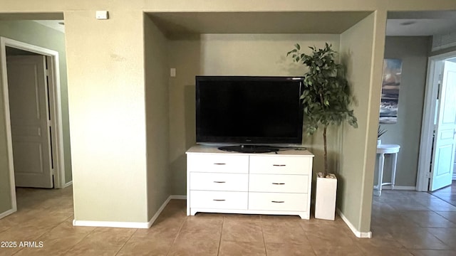 interior space featuring baseboards