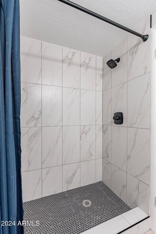 bathroom with a shower with shower curtain