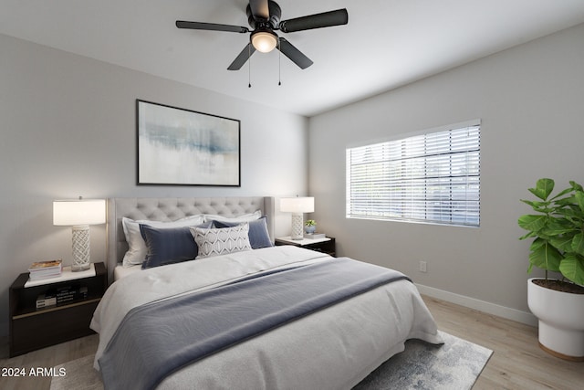 bedroom featuring light hardwood / wood-style floors and ceiling fan