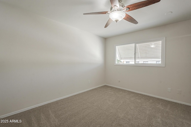 unfurnished room with ceiling fan, carpet floors, and baseboards