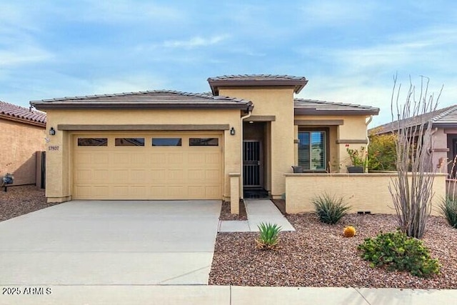 prairie-style home featuring a garage