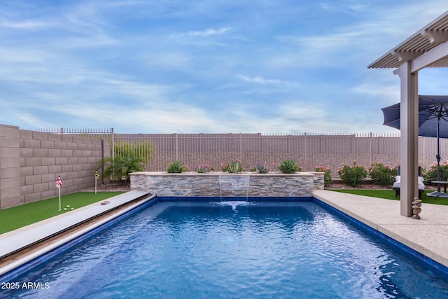 view of pool featuring pool water feature and a patio