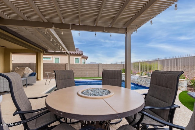 view of patio featuring a fenced in pool and pool water feature