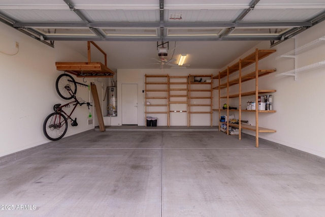 garage with a garage door opener and water heater