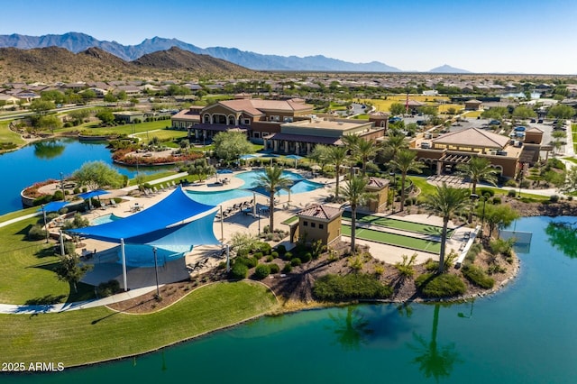 birds eye view of property featuring a water and mountain view