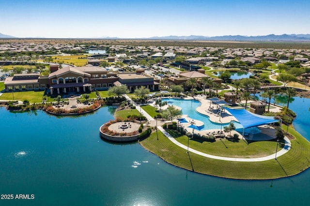 aerial view featuring a water and mountain view