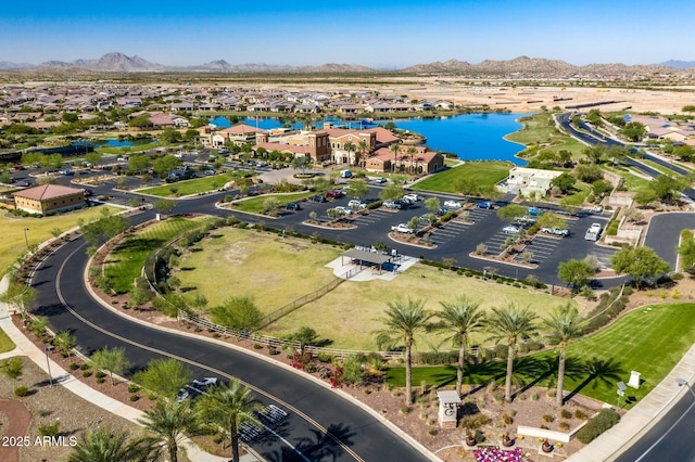 birds eye view of property featuring a water and mountain view