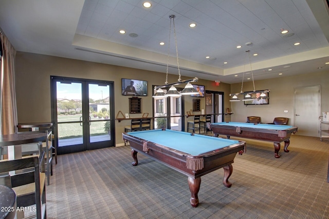 playroom featuring french doors, billiards, a tray ceiling, and carpet