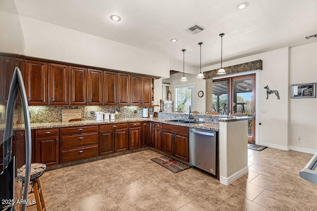 kitchen featuring a sink, a peninsula, backsplash, stainless steel dishwasher, and visible vents
