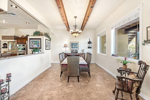 dining area with an inviting chandelier, baseboards, beam ceiling, and visible vents