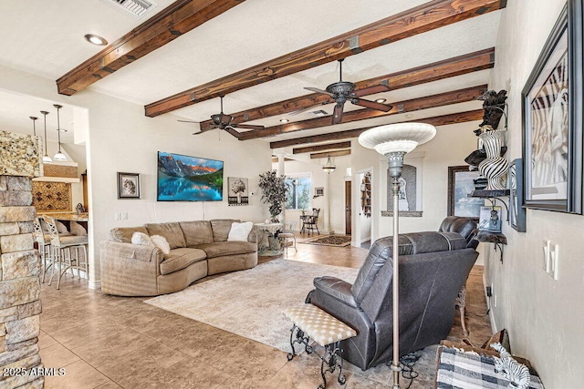 tiled living room with ceiling fan, beamed ceiling, and visible vents
