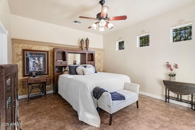 bedroom featuring visible vents, a ceiling fan, and baseboards
