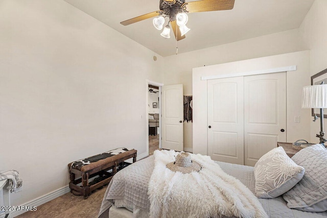 bedroom featuring baseboards, a ceiling fan, high vaulted ceiling, and a closet