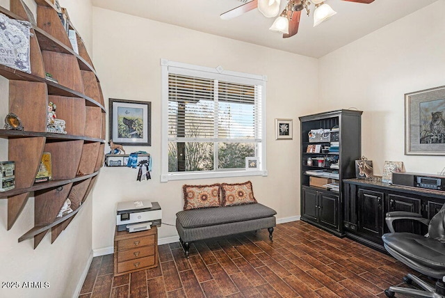 sitting room featuring baseboards, a ceiling fan, and dark wood finished floors
