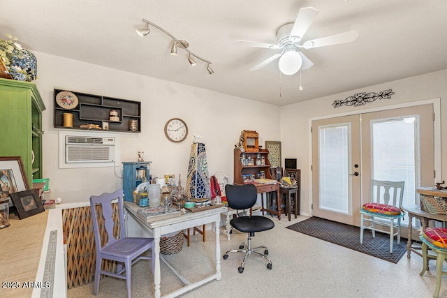 home office with french doors, a ceiling fan, and a wall mounted AC