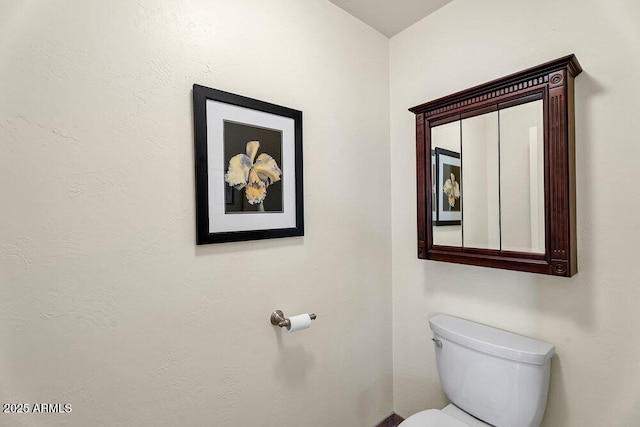 half bath featuring toilet