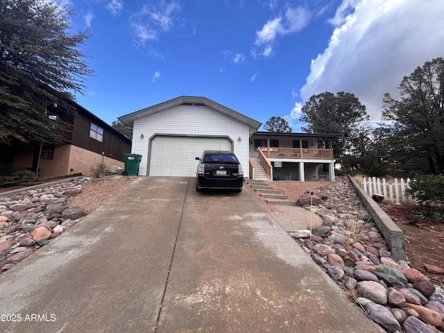 view of front of home featuring a garage and a deck