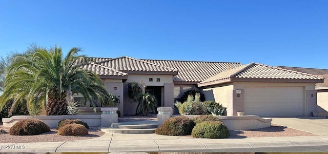 mediterranean / spanish-style home featuring a garage