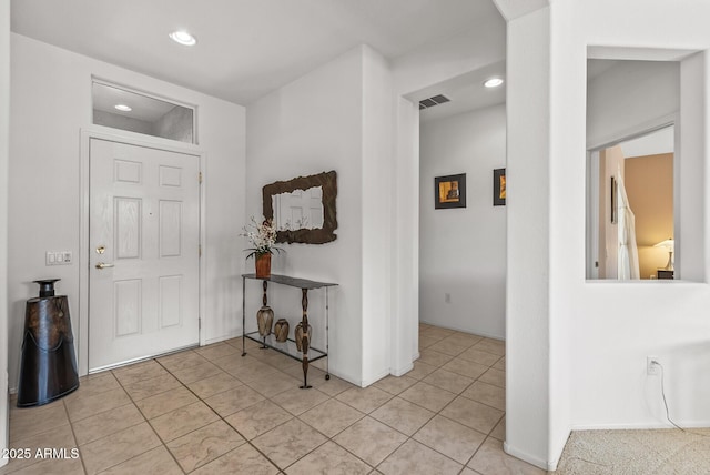 foyer with light tile patterned flooring