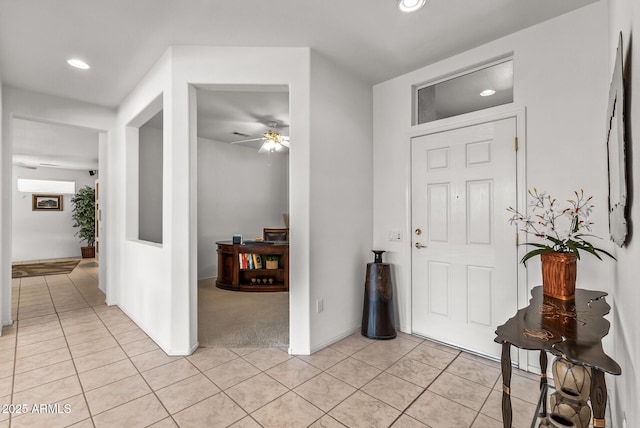 tiled foyer entrance with ceiling fan