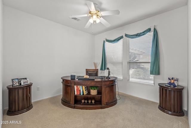 carpeted home office with ceiling fan