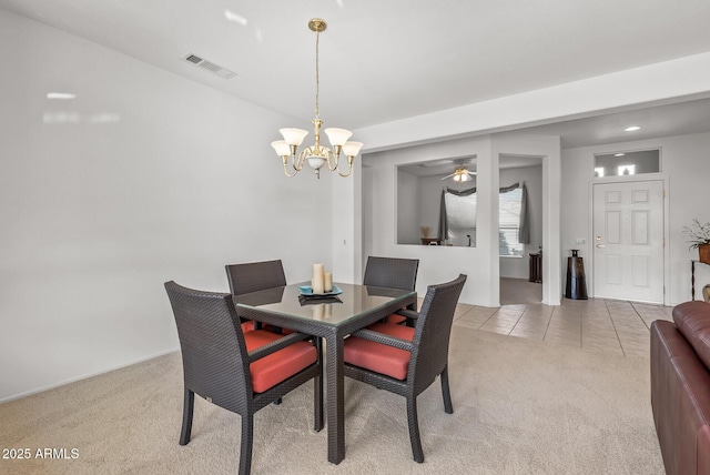 dining area featuring light carpet