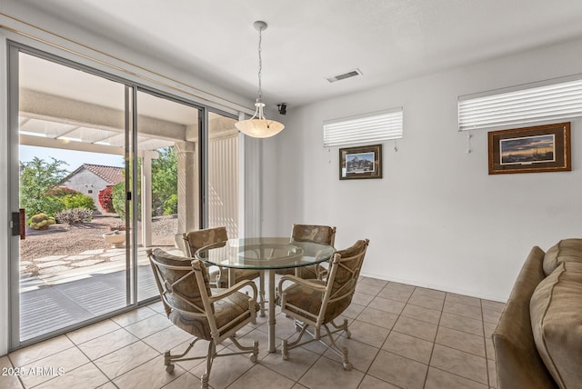 dining room featuring light tile patterned floors