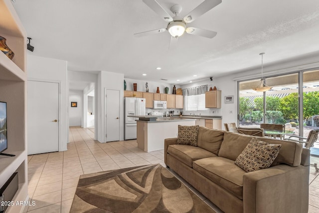 living room with light tile patterned floors and ceiling fan