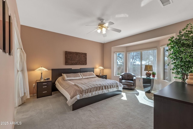 bedroom featuring ceiling fan and light colored carpet