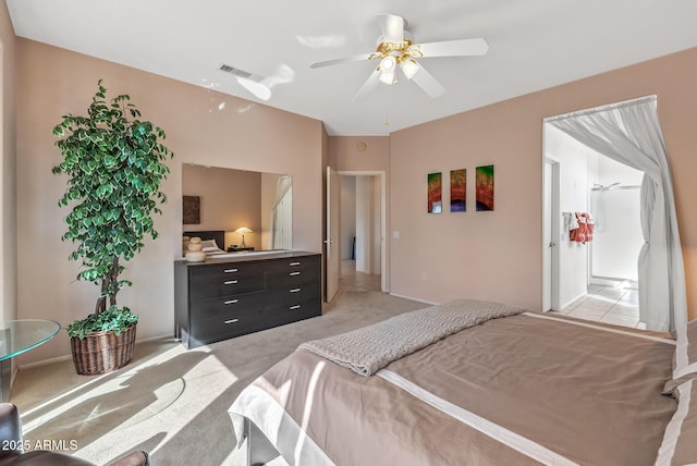 bedroom featuring light colored carpet and ceiling fan