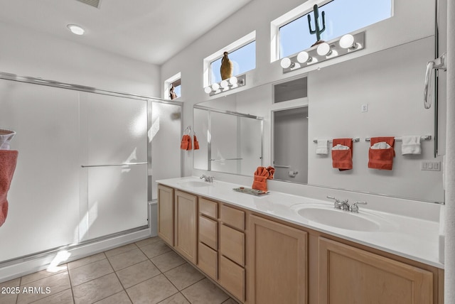 bathroom with vanity, tile patterned floors, and walk in shower