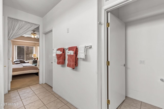 bathroom with tile patterned flooring and ceiling fan