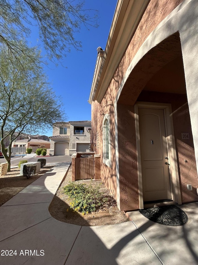 view of exterior entry featuring a garage