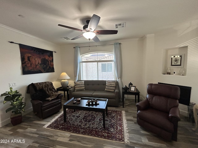 living room with hardwood / wood-style floors, ceiling fan, and crown molding