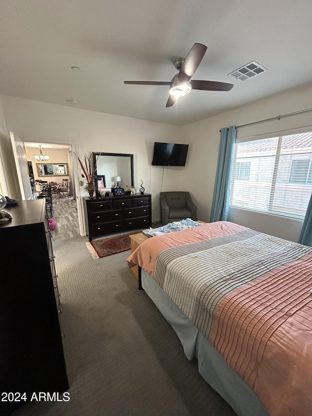 bedroom featuring ceiling fan and carpet floors