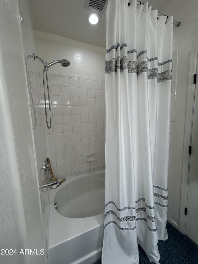 bathroom with shower / tub combo